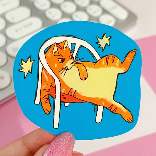 Orange Cat in White Plastic Chair Sticker