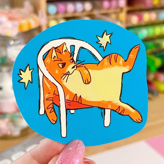Orange Cat in White Plastic Chair Sticker